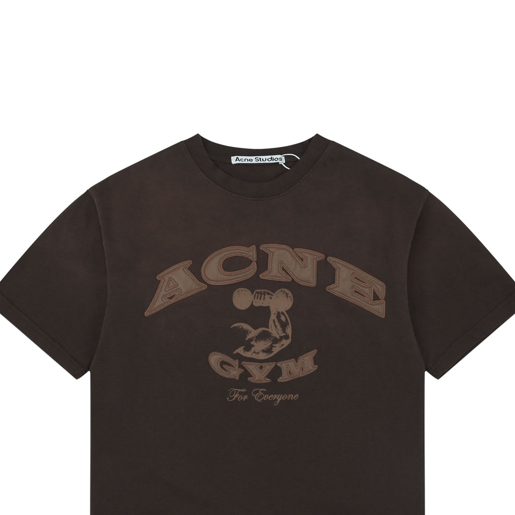 Acne Studios Arched Appliqué Letter Graphic T-Shirt in Dark Brown